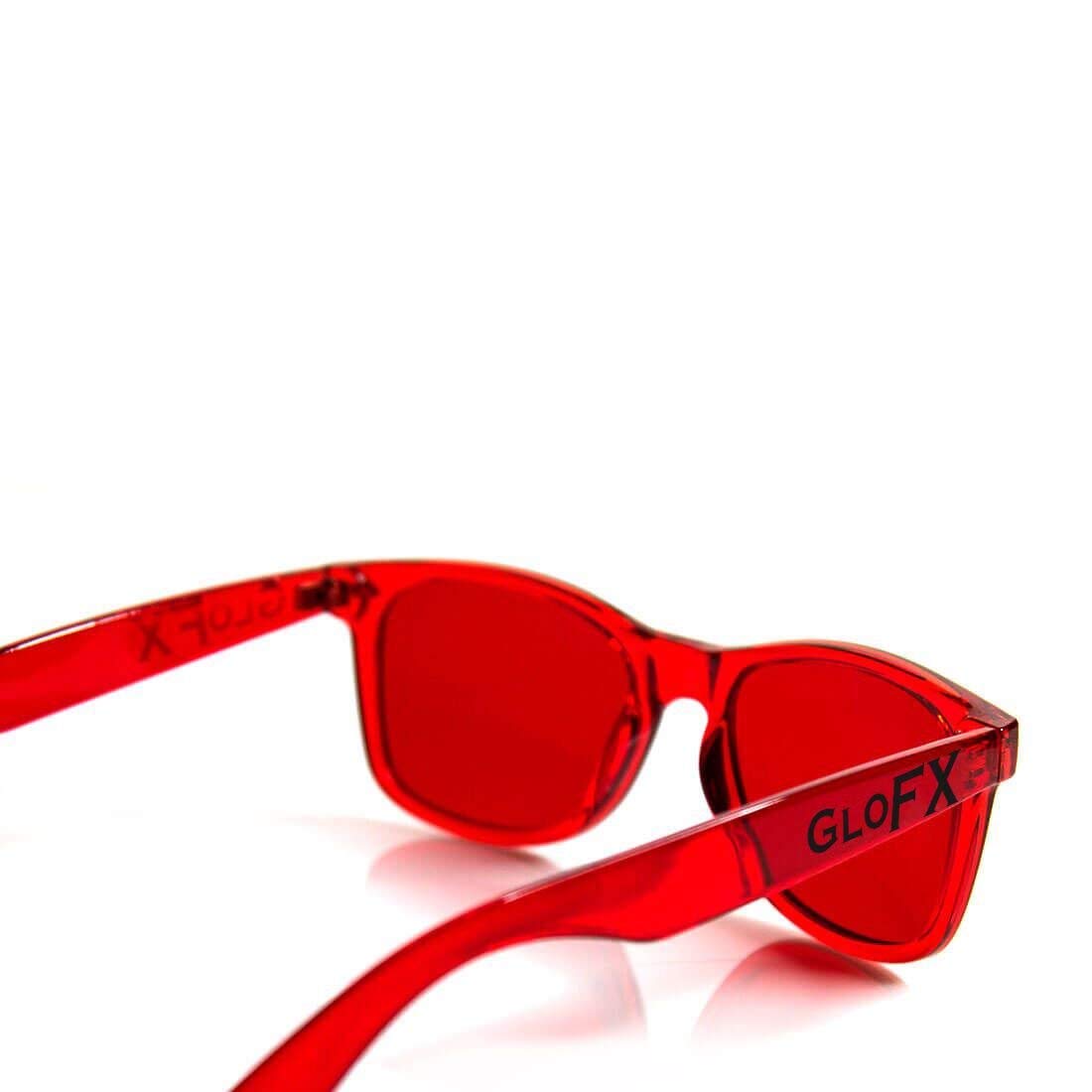 GloFX user wearing red therapy glasses during a workout session.