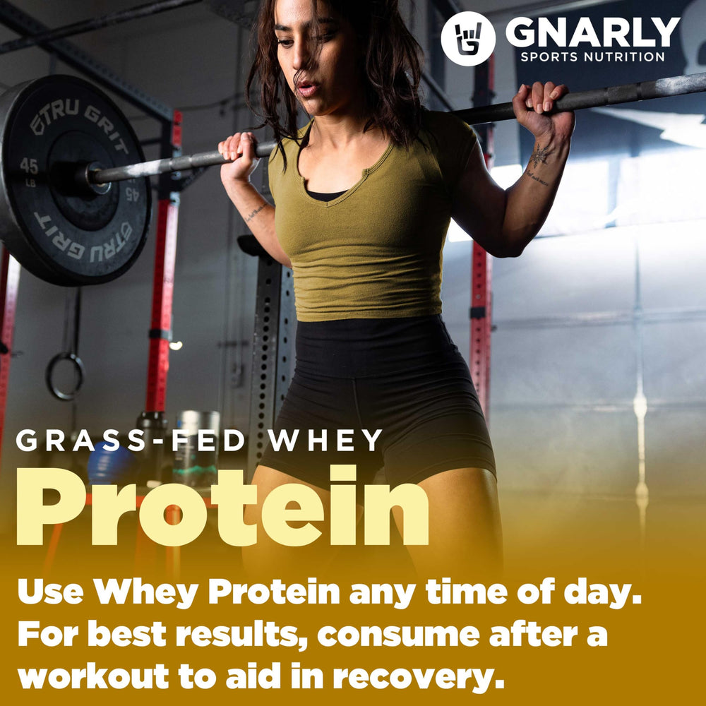 Pouring Gnarly chocolate protein powder into a blender bottle
