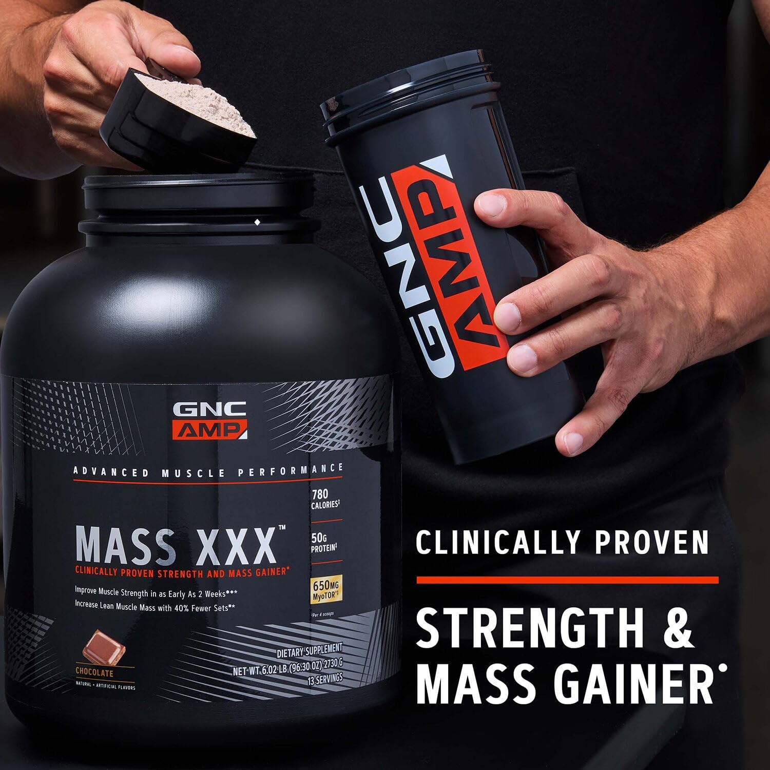 GNC AMP Mass XXX measuring scoop beside container emphasizes convenience