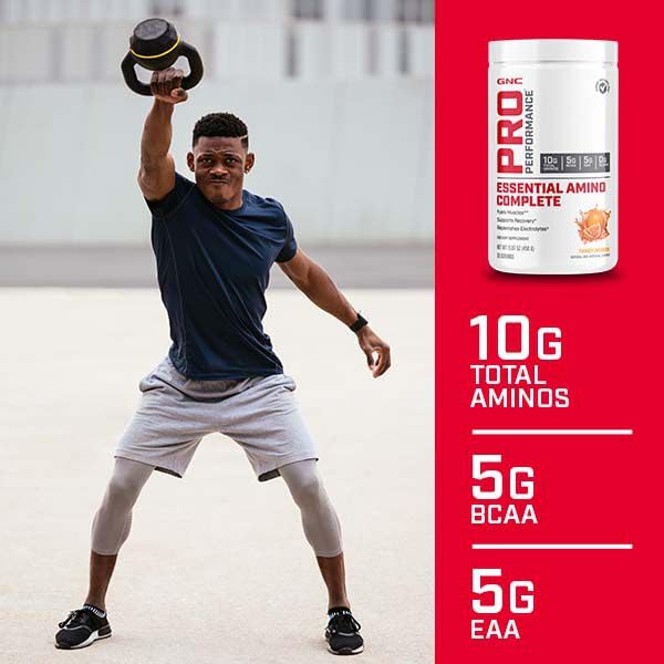 GNC Pro Performance Essential Amino Complete bottle pouring into shaker for quick hydration.