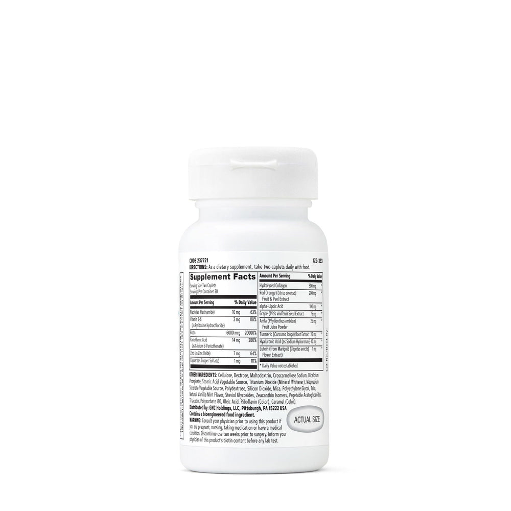 GNC capsules closeup showing easy-to-take caplets for daily beauty routines.