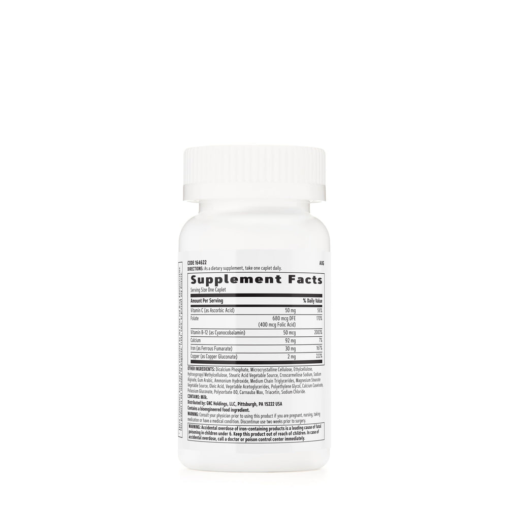 GNC Women's Iron Complete caplets closeup showing enteric coating for gentle digestion.
