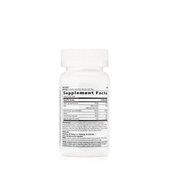 GNC Women's Iron Complete caplets closeup showing enteric coating for gentle digestion.