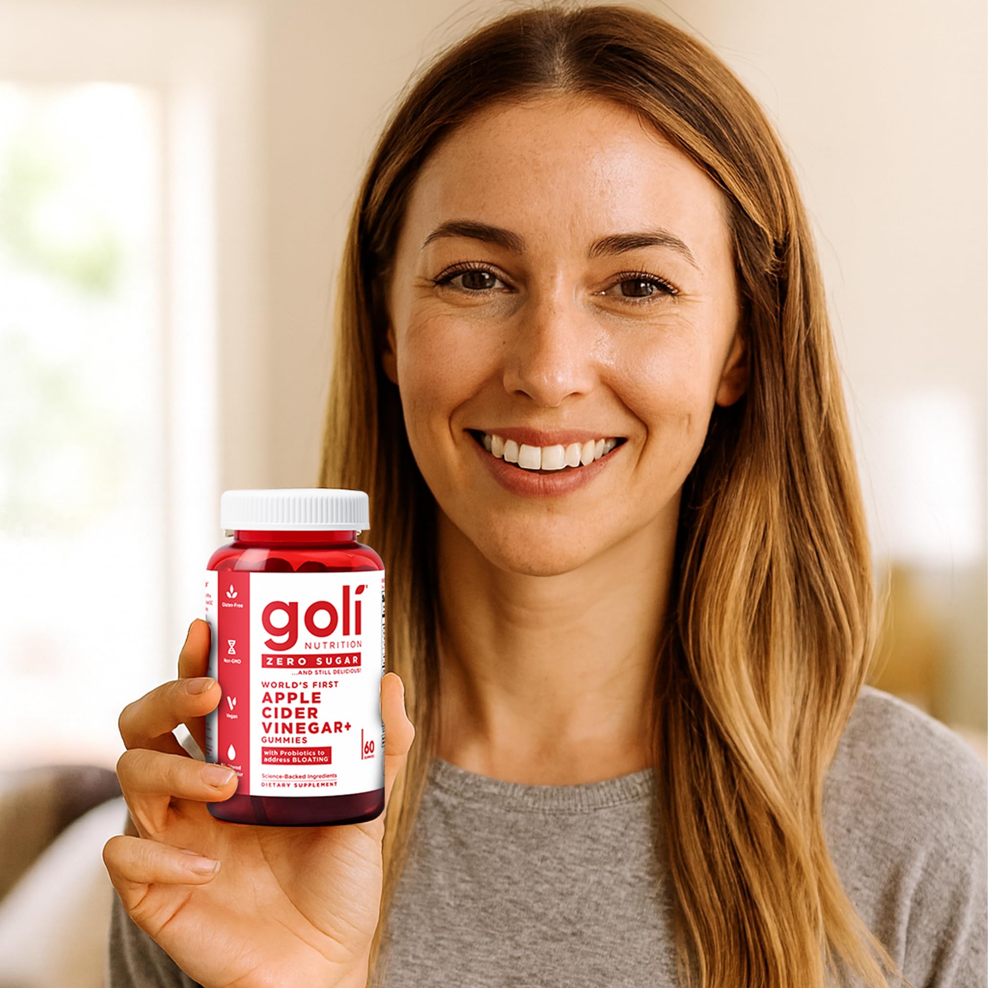 Goli daily-use gummies in hand for morning routine.