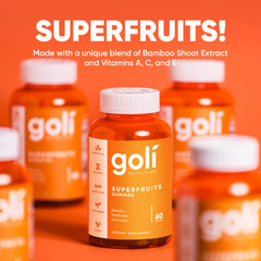 Goli Superfruits bottle being poured with gummies for daily beauty routine