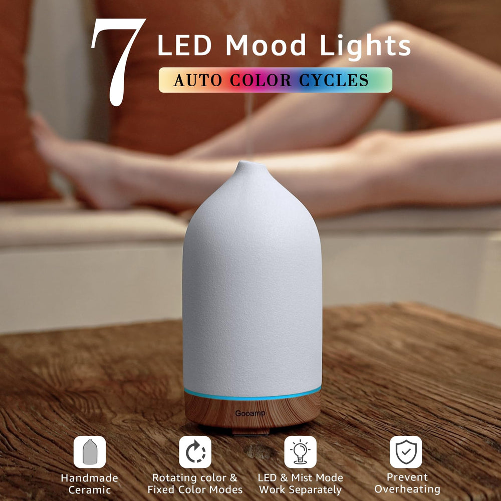 Close-up of Gooamp ceramic diffuser showing wood grain base and craftsmanship