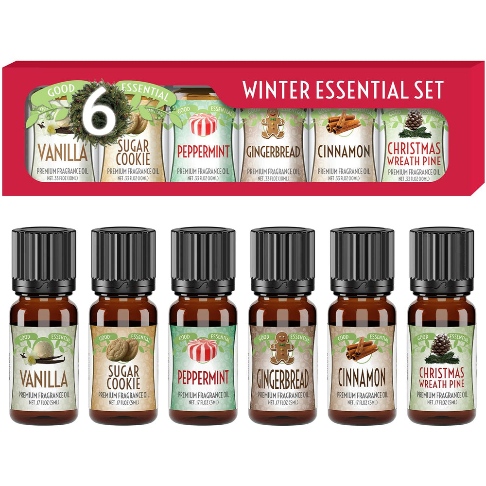 Good Essential Winter fragrance oil set lifestyle shot with candles and diffusers.