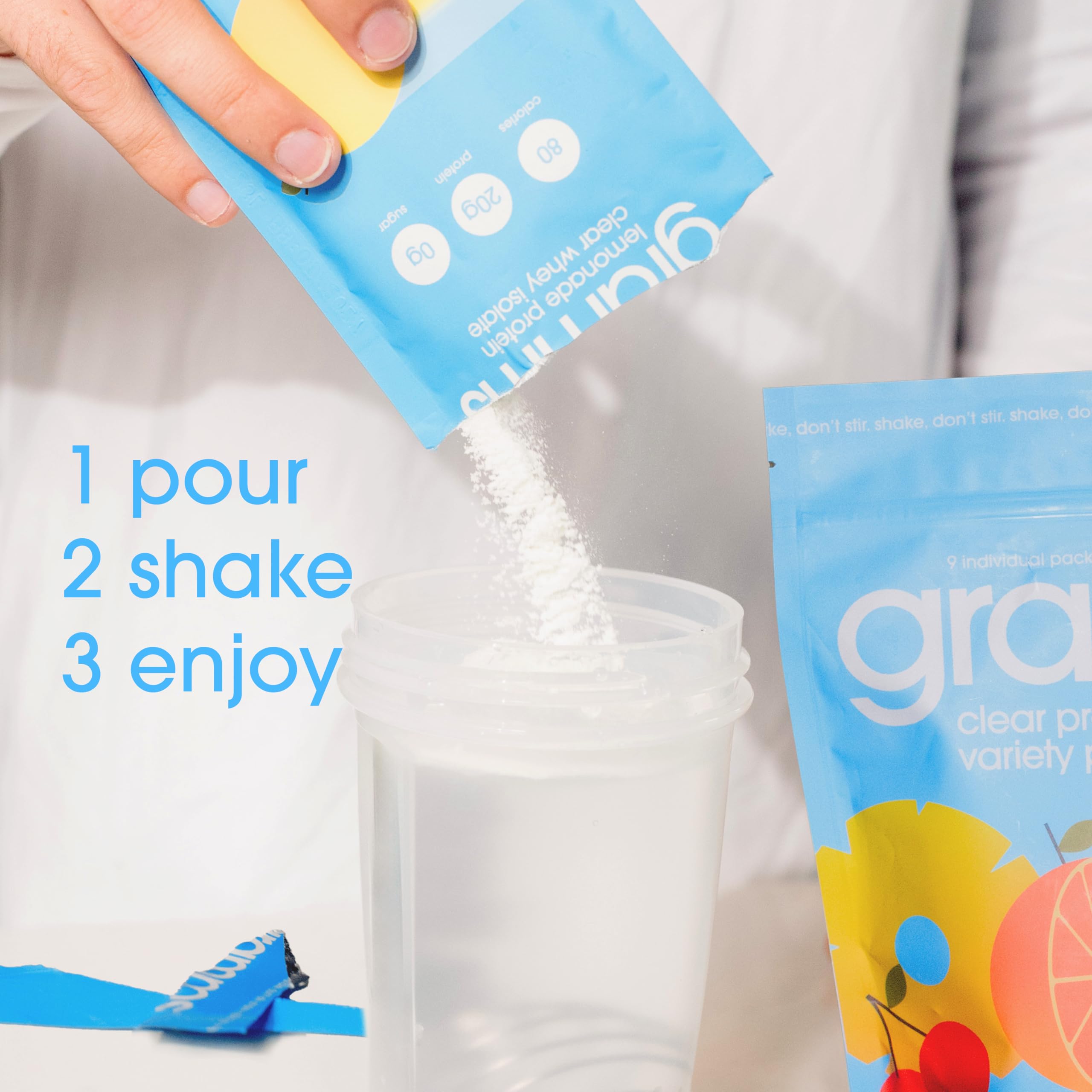 GRAMMS Clear Protein Water packets on a kitchen counter; clean ingredients emphasized.