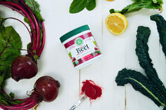 Green Foods Beet Essence OG2 bottle beside beets, vibrant color inspiration for meals