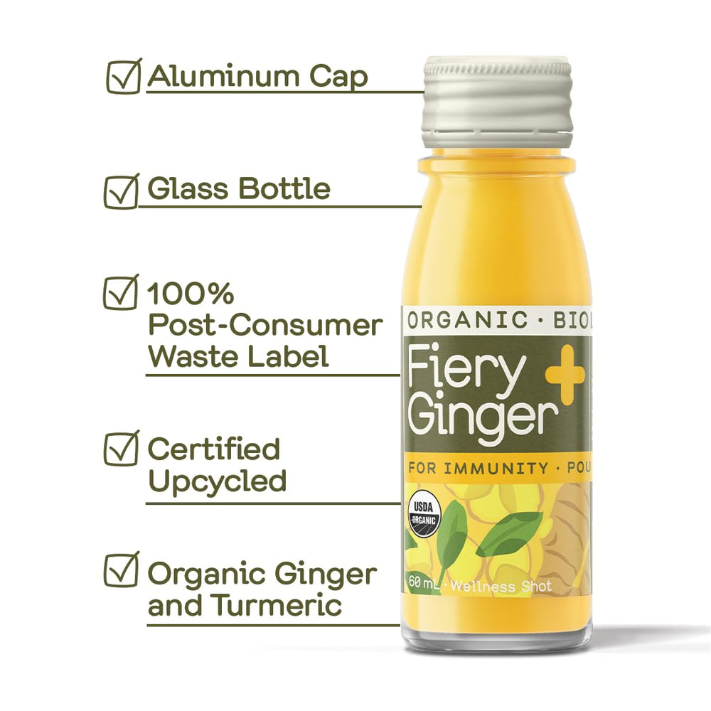 Greenhouse Juice Fiery Ginger Shot glass closeup showing vibrant liquid