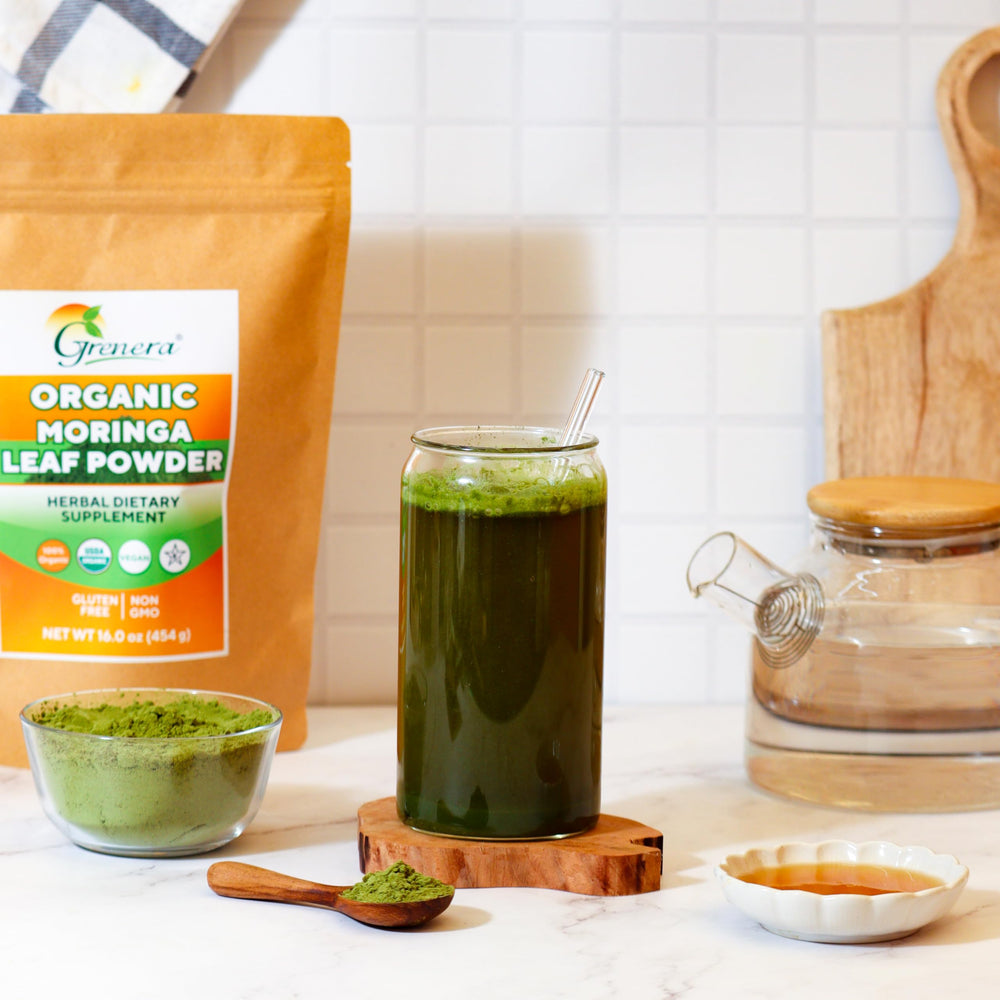Grenera Moringa powder scoop in glass; easy daily mix for shakes and tea.