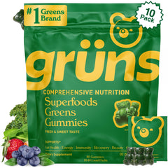 Grüns Super Greens Gummies bottle in strawberry flavor for daily nutrition.