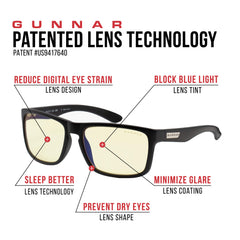 Gunnar amber-tint reading glasses on desk with microfiber pouch nearby.