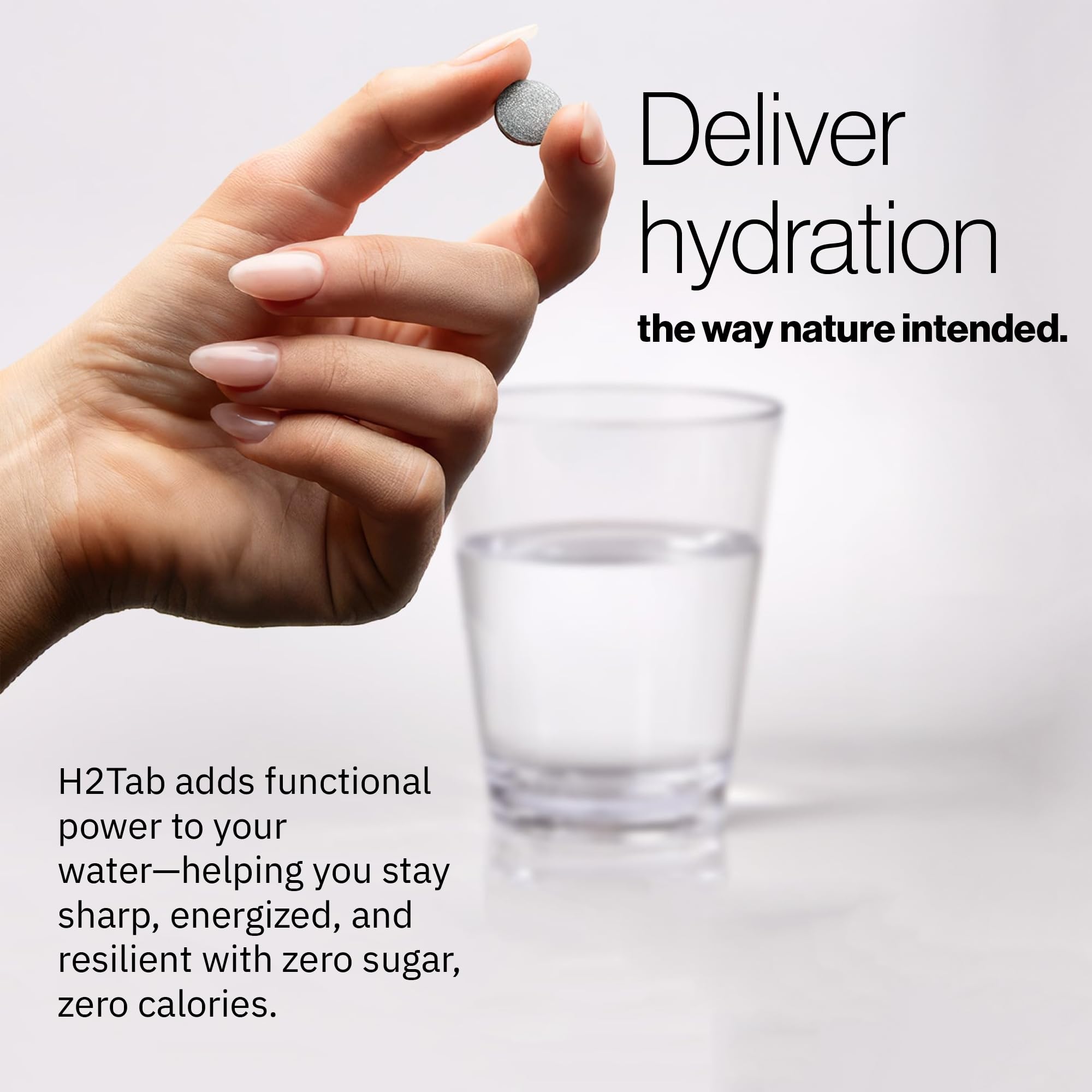 H2TAB glass of water with raspberry flavor ready to drink after workout