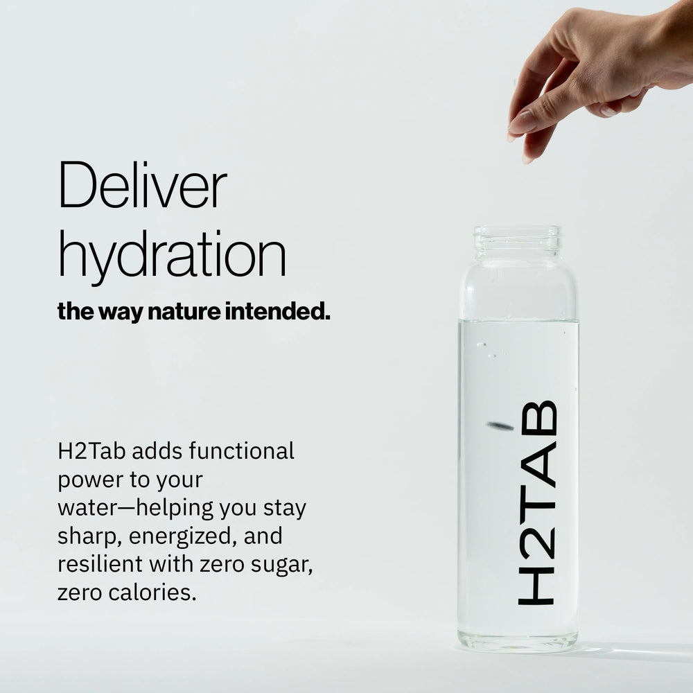 Close-up of an unflavored H2TAB tablet showing a clean formula.