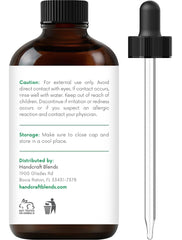 Close-up of Handcraft Blends Thyme Essential Oil showing crystal-clear liquid.