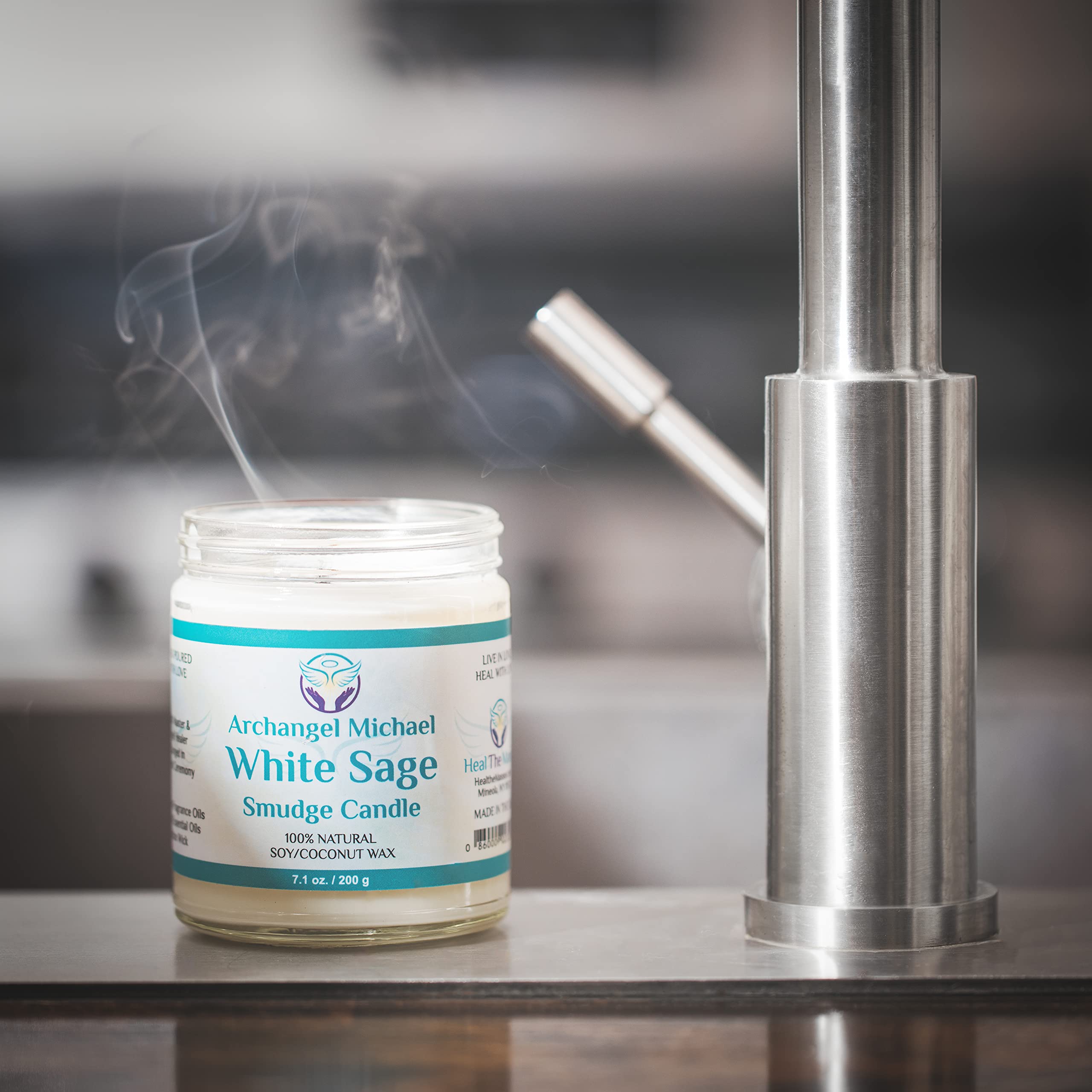 Heal The Masses White Sage Candle on a desk or workspace supports a tranquil work environment.