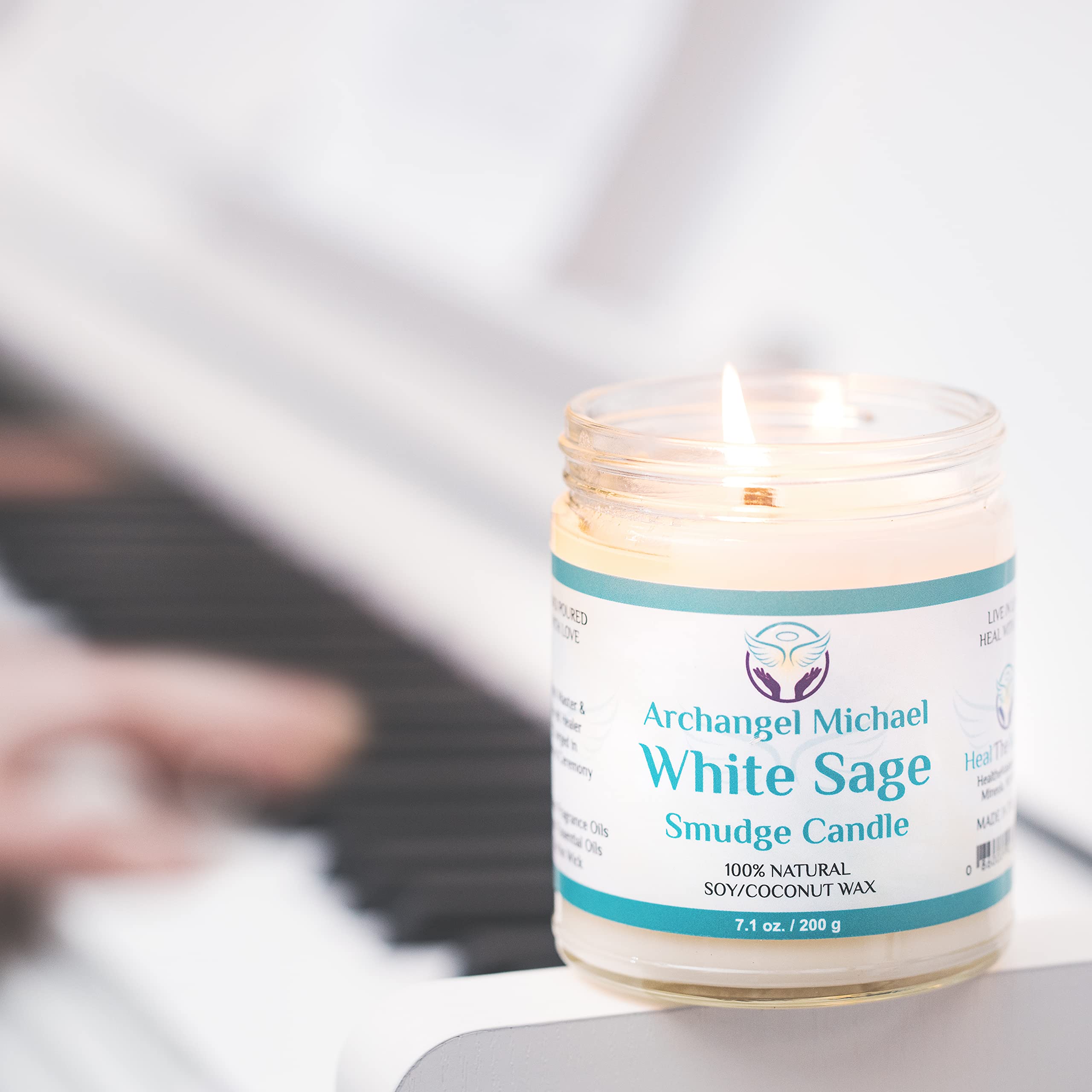 Heal The Masses White Sage Candle with wick-lit ambiance evokes focused intention during rituals.