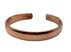 Healing Lama copper bracelet side view highlights sturdy build and bold metallic color