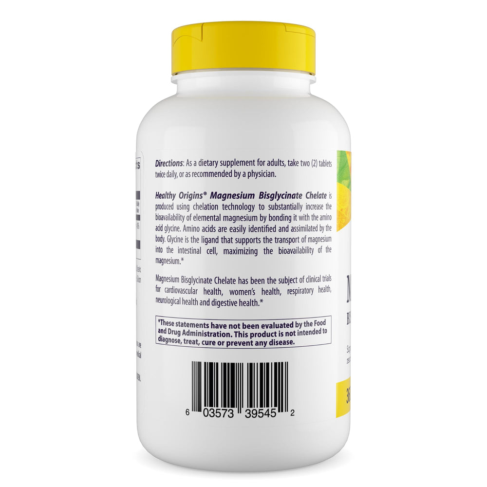 Healthy Origins Magnesium Bisglycinate Chelate tablets close-up beside a glass for daily use.