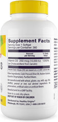 Vitamin D3 softgels spilling from Healthy Origins bottle for immune support.