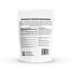 Micronized creatine powder scoop showing ultra-fine texture for fast mix.