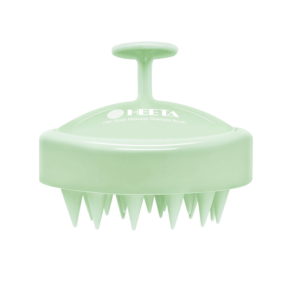 HEETA scalp massager with soft silicone bristles for gentle cleansing and relaxation.