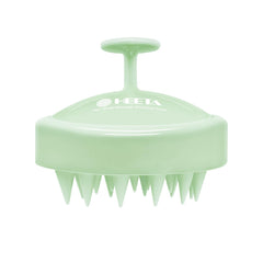 HEETA scalp massager with soft silicone bristles for gentle cleansing and relaxation.