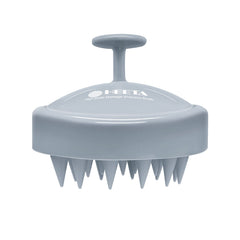 HEETA scalp massager with soft silicone bristles for gentle exfoliation and relaxation.