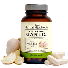 Herbal Roots garlic pill bottle on table for daily routine and immune-friendly use.
