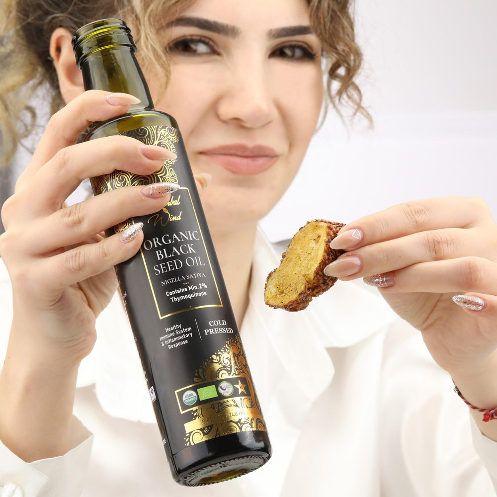 Herbal Wind Black Seed Oil on kitchen counter ready for use.