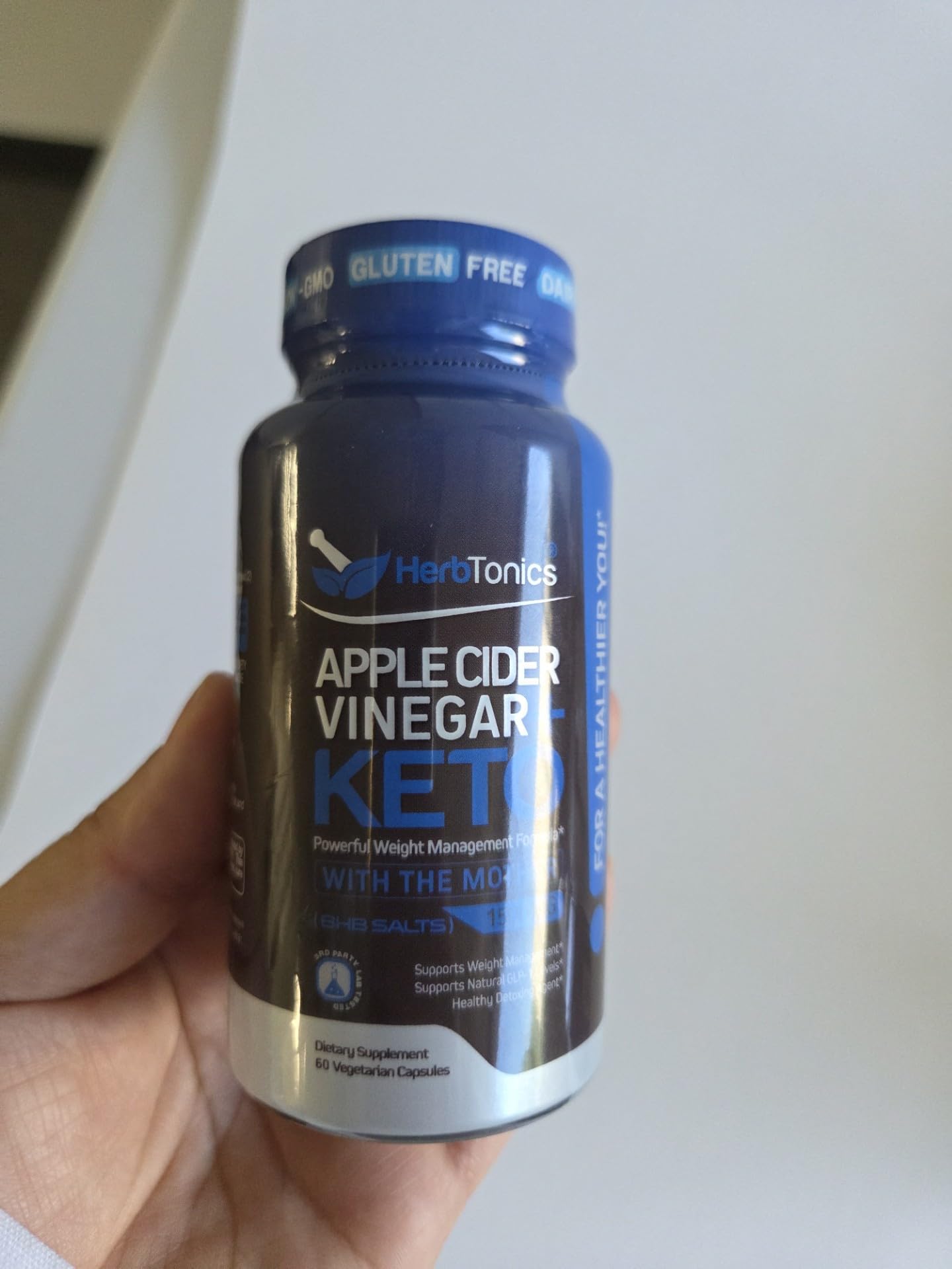 Herbtonics on a breakfast table demonstrating how capsules fit into morning routines