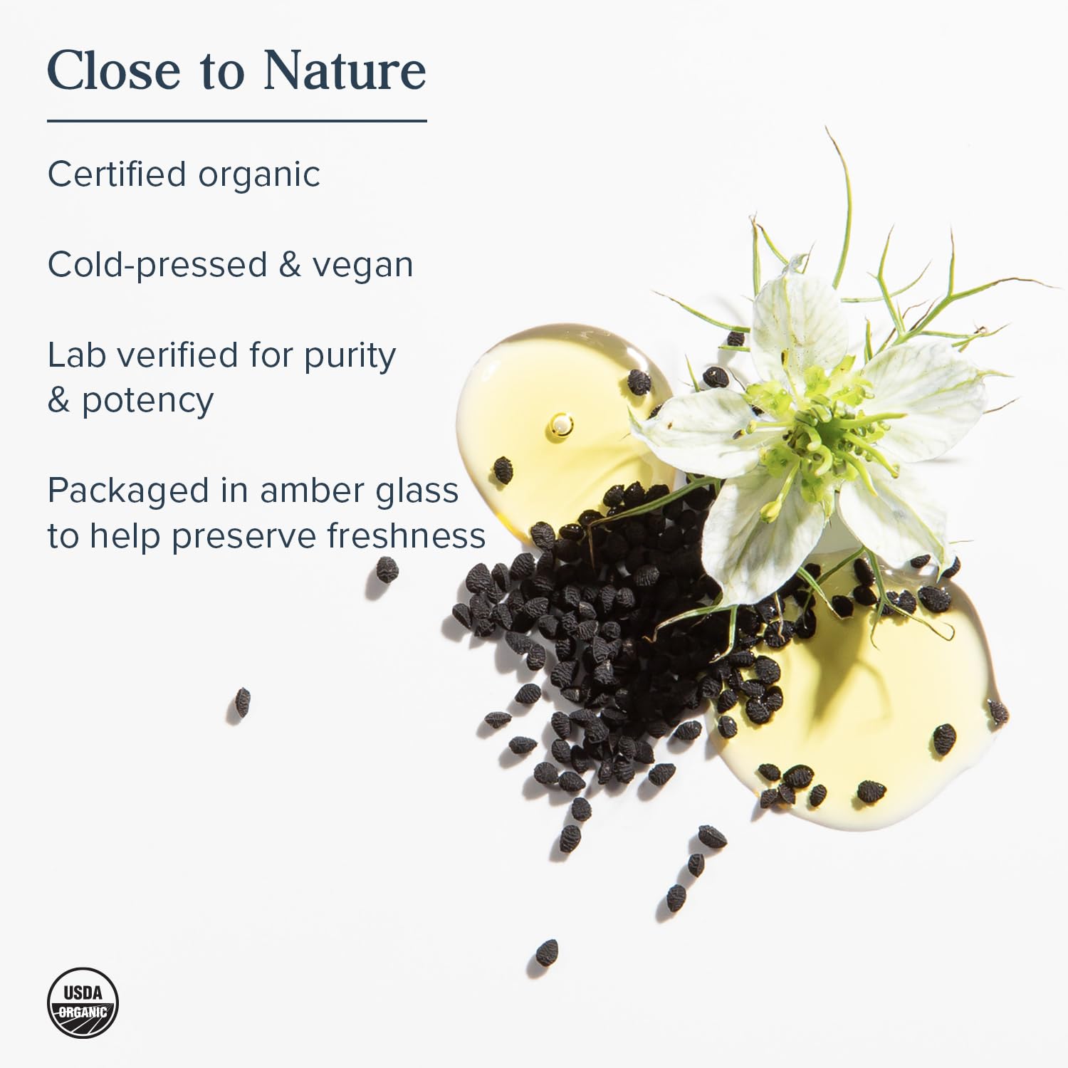 Heritage Store Black Seed Oil glass bottle display, highlighting amber preservation.