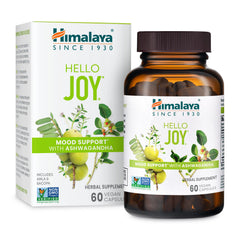 Himalaya Hello Joy bottle on wood surface promotes a positive outlook.
