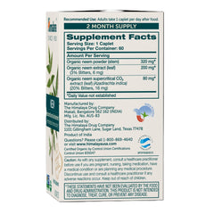 Himalaya Neem bottle pour with capsules ready for daily routine.