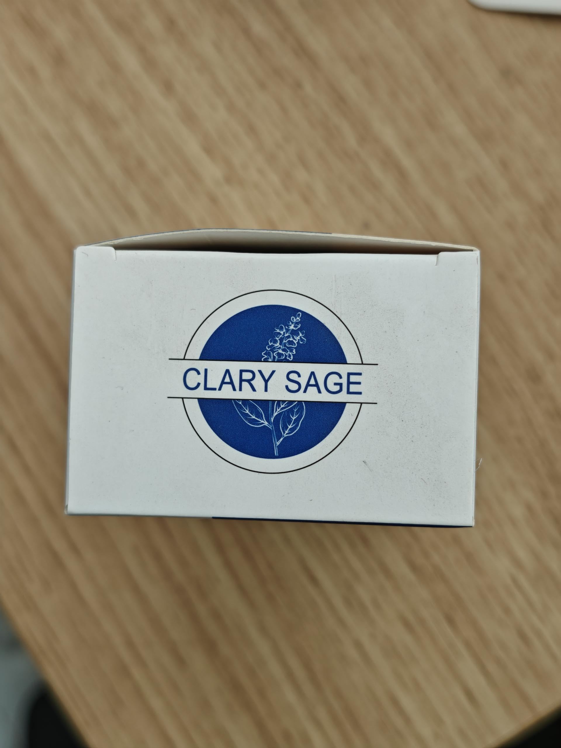 HIQILI Clary Sage Oil amber bottle with label.
