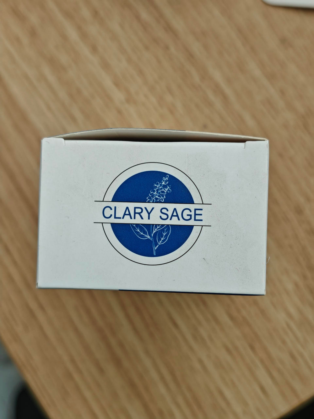 HIQILI Clary Sage Oil amber bottle with label.