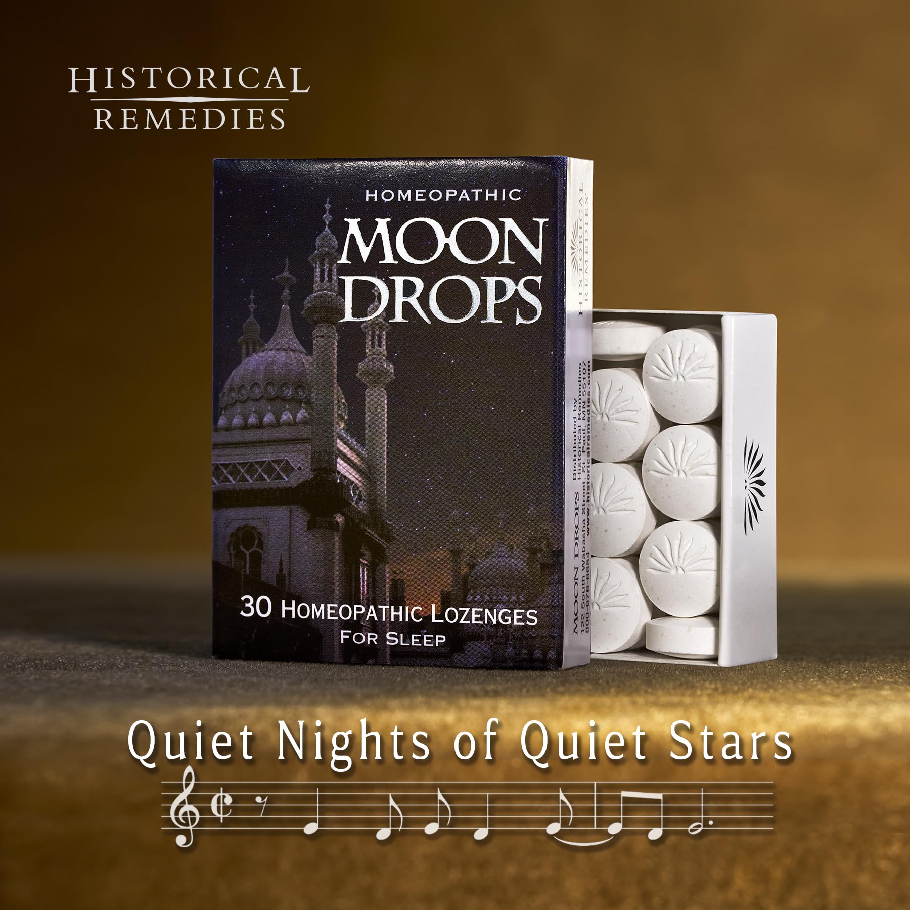 Historical Remedies Moon Drops vanilla lozenge on surface for calming, easy sleep.