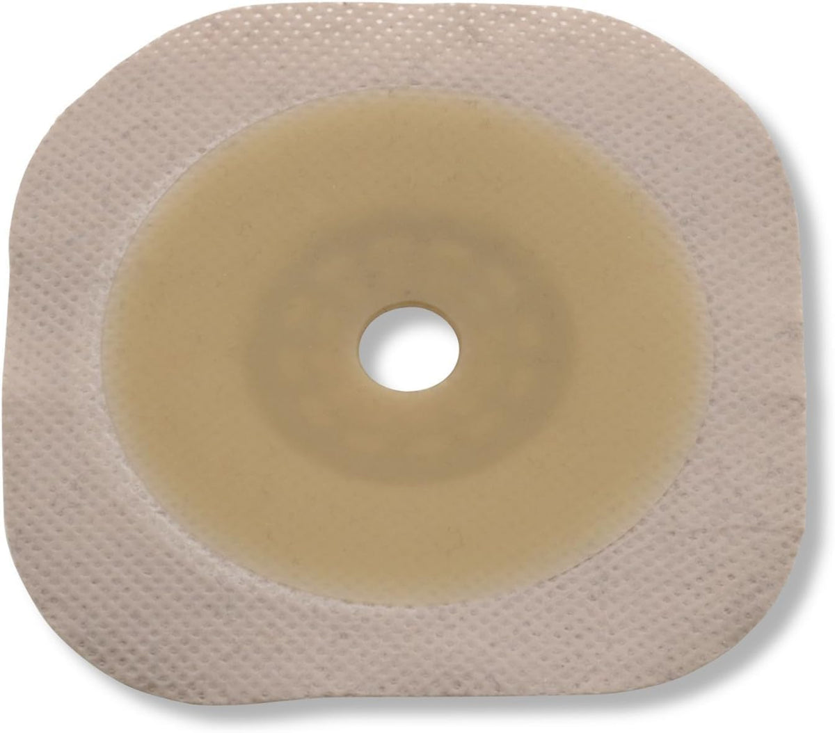 Hollister 14604 flat Flextend barrier with beige floating flange reduces abdominal pressure during pouch attachment.