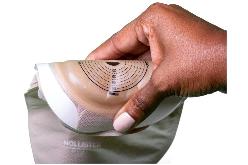 Adhesive border supports secure coupling without excessive abdominal pressure.