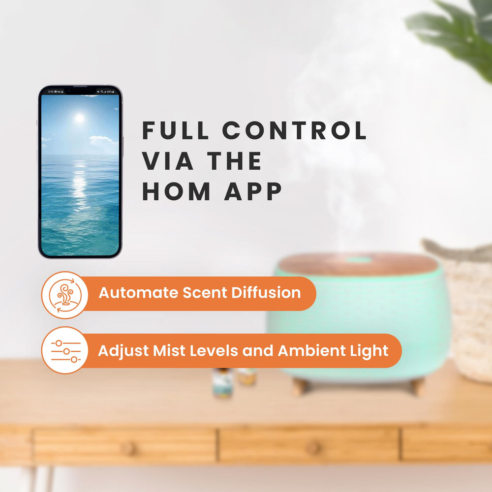 HŌM whisper-quiet ultrasonic diffuser emits a soft mist for peaceful spaces.