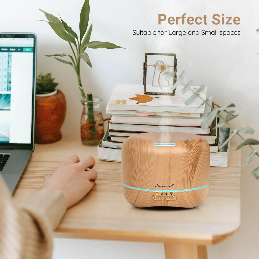 Homeweeks diffuser night light emits soft color glow.