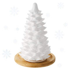 Honeydak Christmas tree diffuser on white ceramic for festive ambiance.