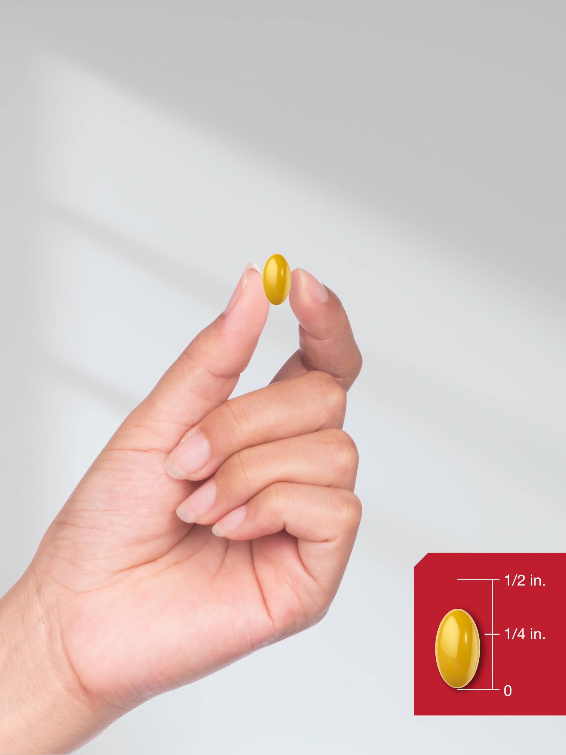 Open bottle pouring CoQ10 softgels into hand.
