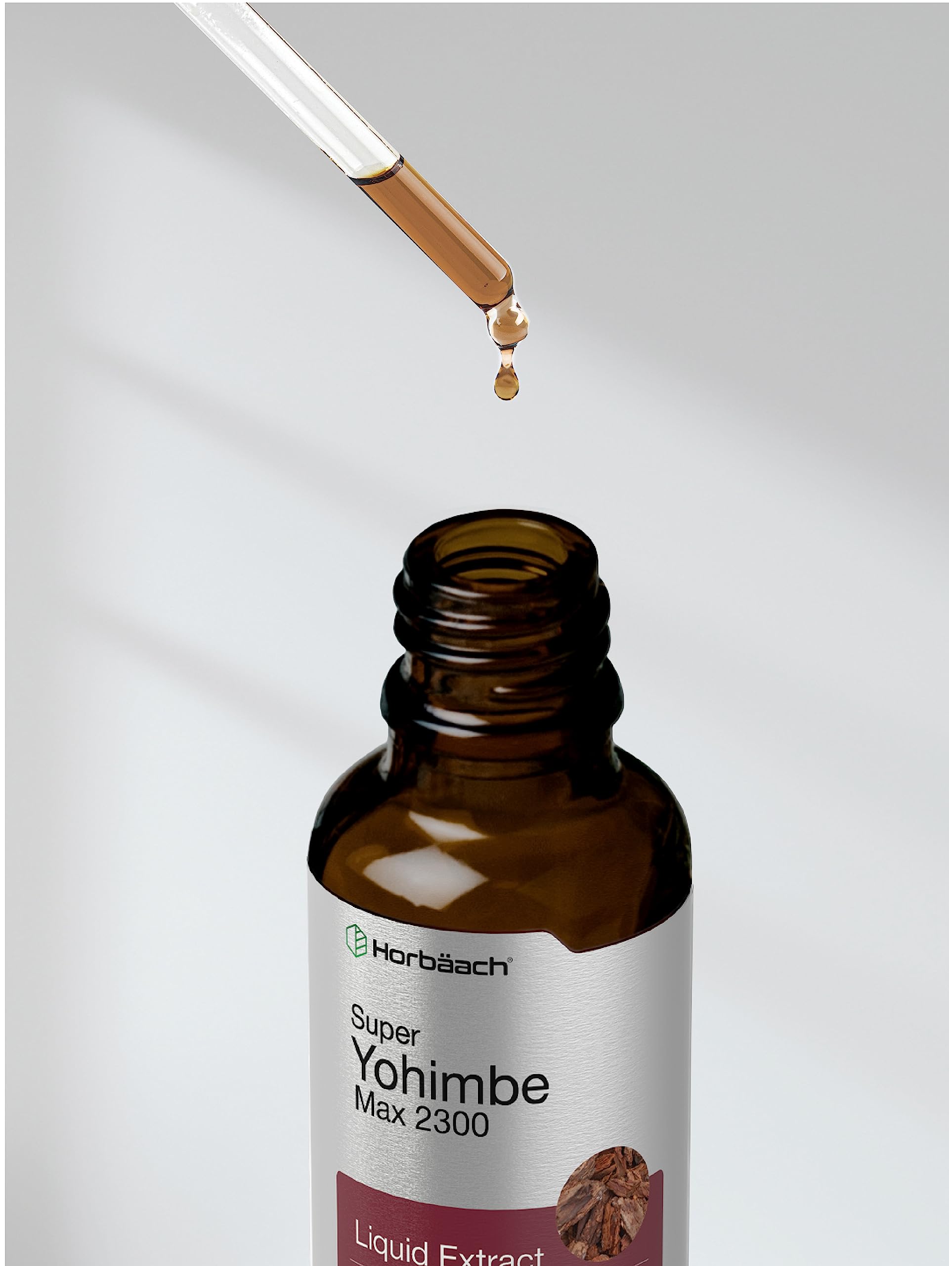 Horbäach Yohimbe drops beside a glass for easy daily use