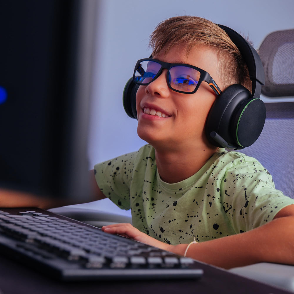Horus X Kids blue light glasses side profile for all-day wear under headsets.