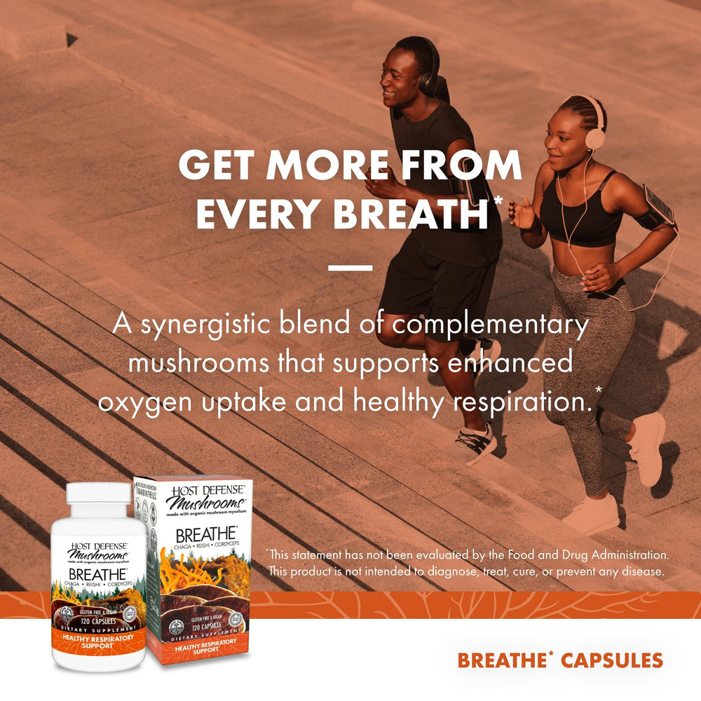 Host Defense Breathe capsules in hand ready for daily use.