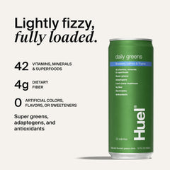 Pouring Huel Daily Greens into a glass for a zesty start to the day.