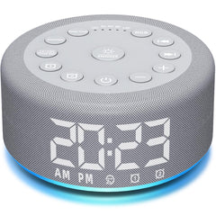 Hushing sound machine on a nightstand with a warm night light for bedtime.