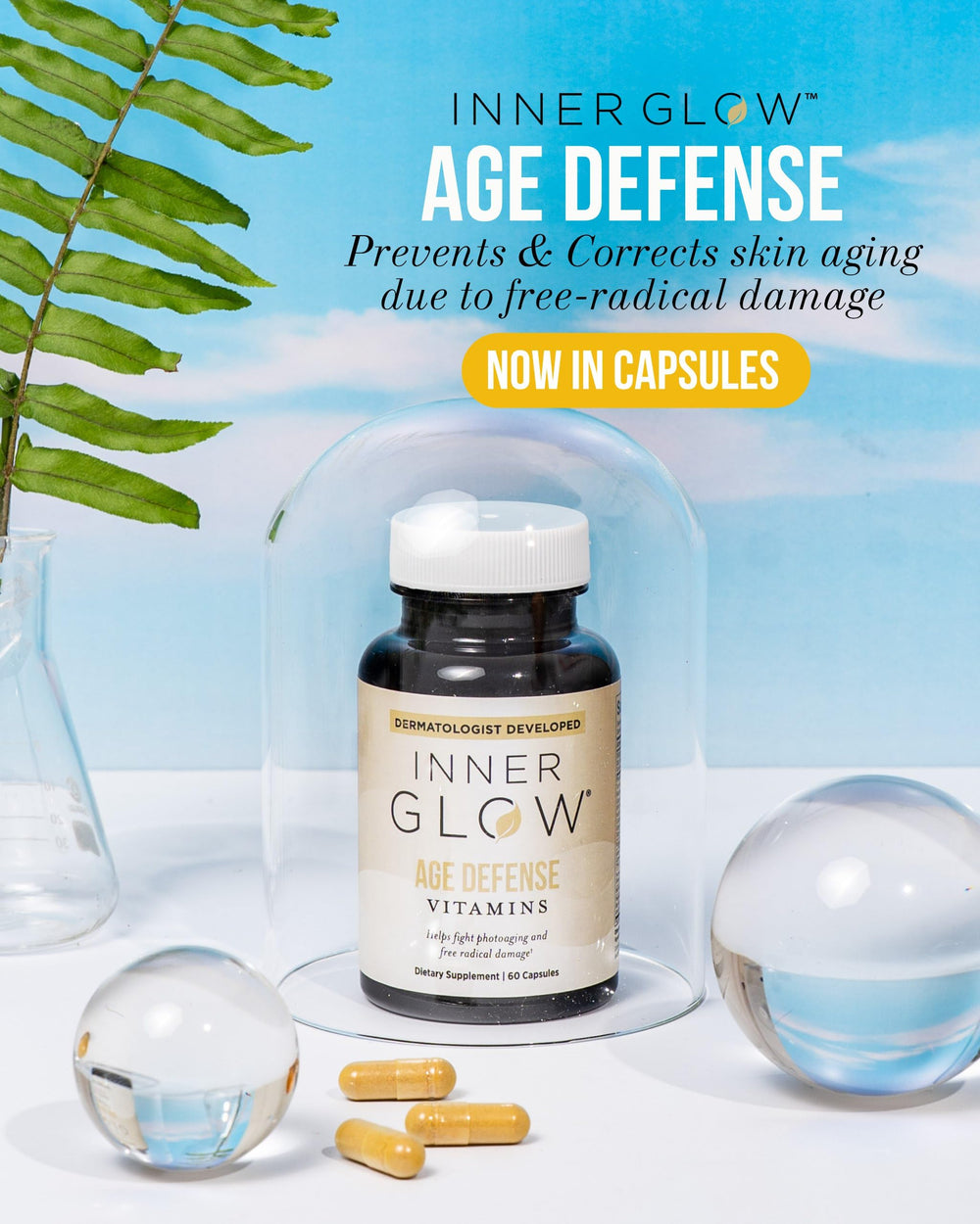 Inner Glow Age Defense capsules pile on a clean countertop.
